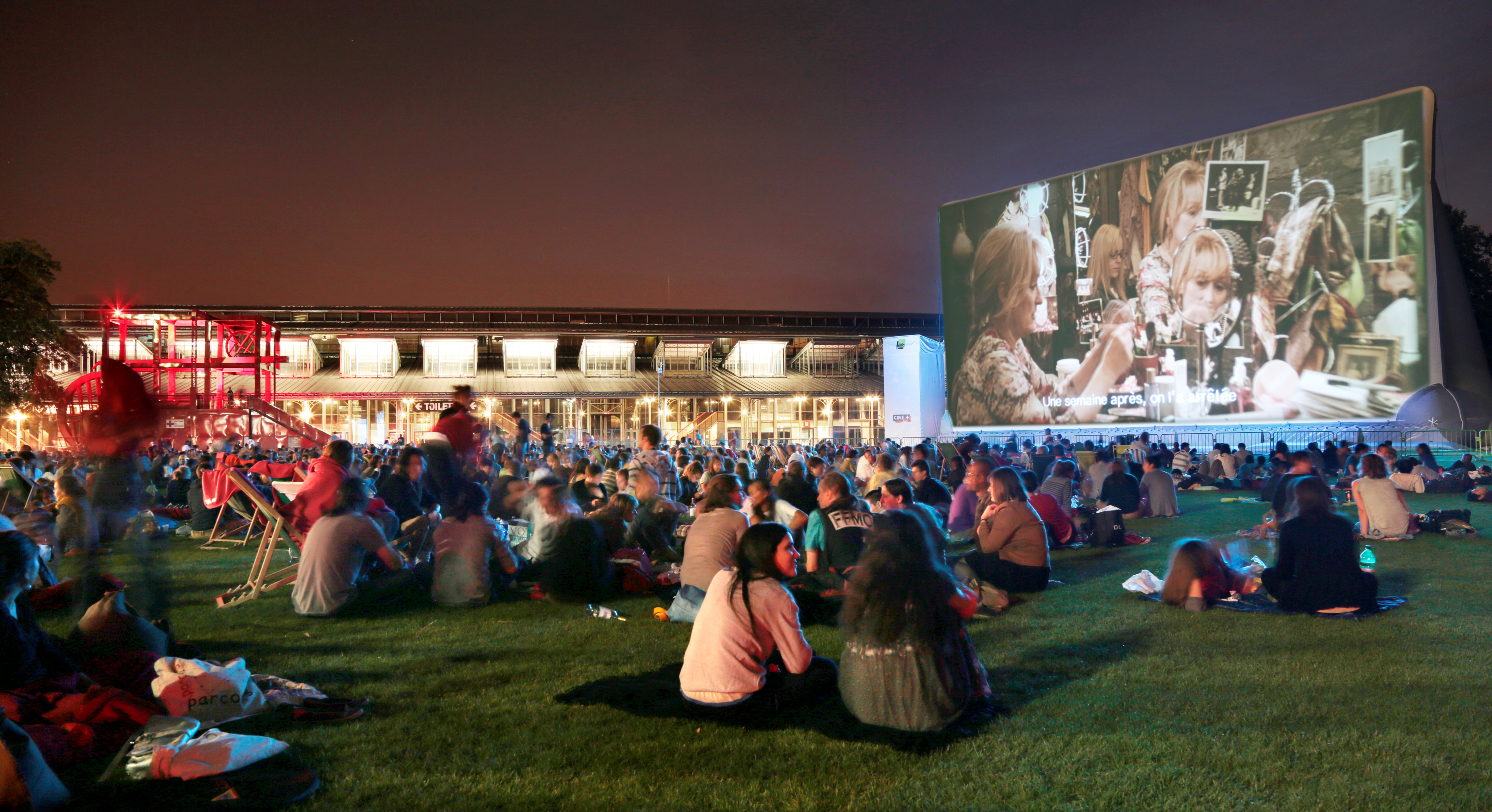 Locals watch a movie at the outdoor cinema at La Villette.