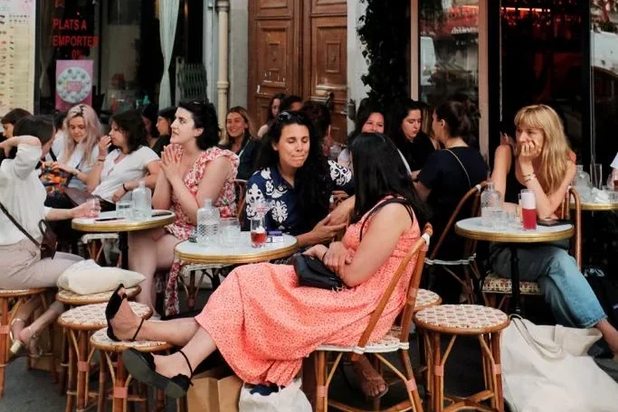 Clients enjoying Bisou's custom-made drinks on their terrace in Paris.