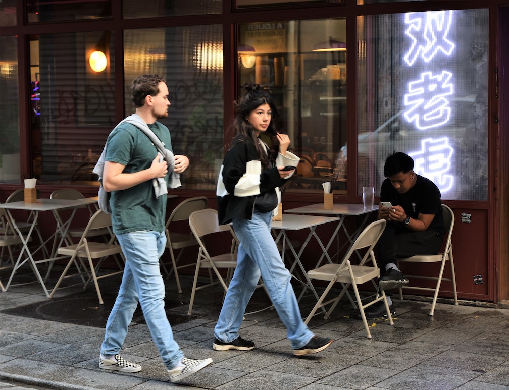 A woman wearing jeans in Paris, ignoring the law that made it illegal for women to wear pants until recently.