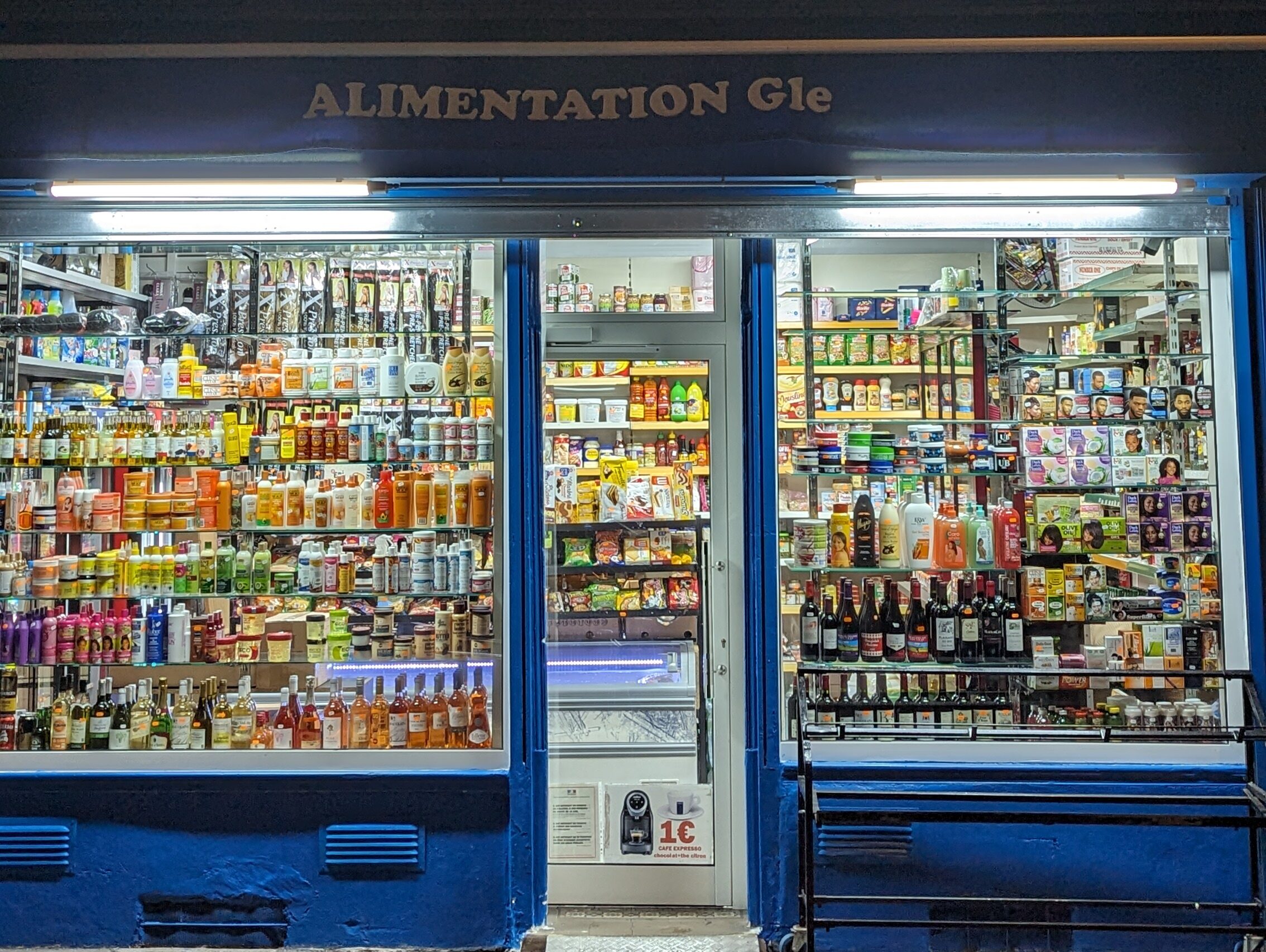 A lit up deli in the 14th arrondissement in Paris.