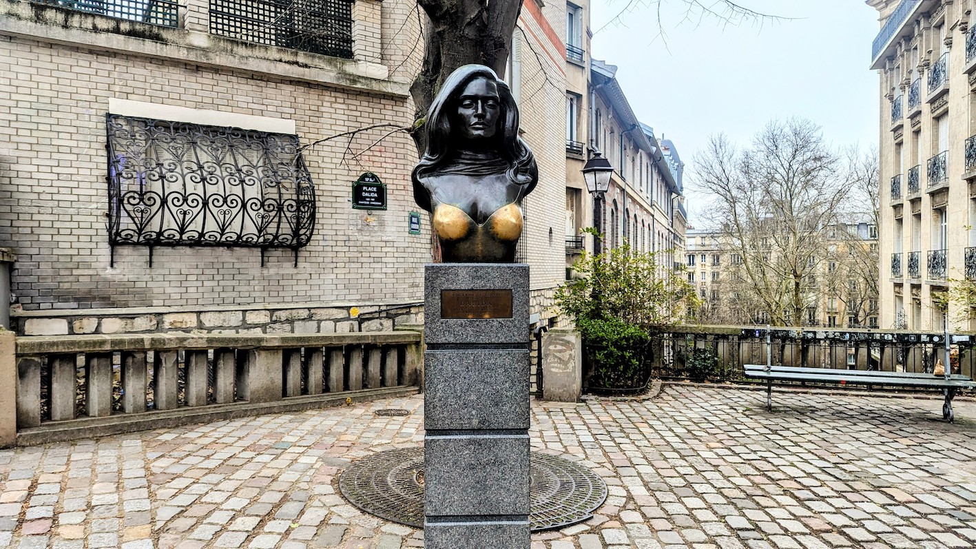 The bust of singer Dalida on Place Dalida in Montmartre, Paris. Her breasts, said to bring good luck to those who touch them, shine golden.