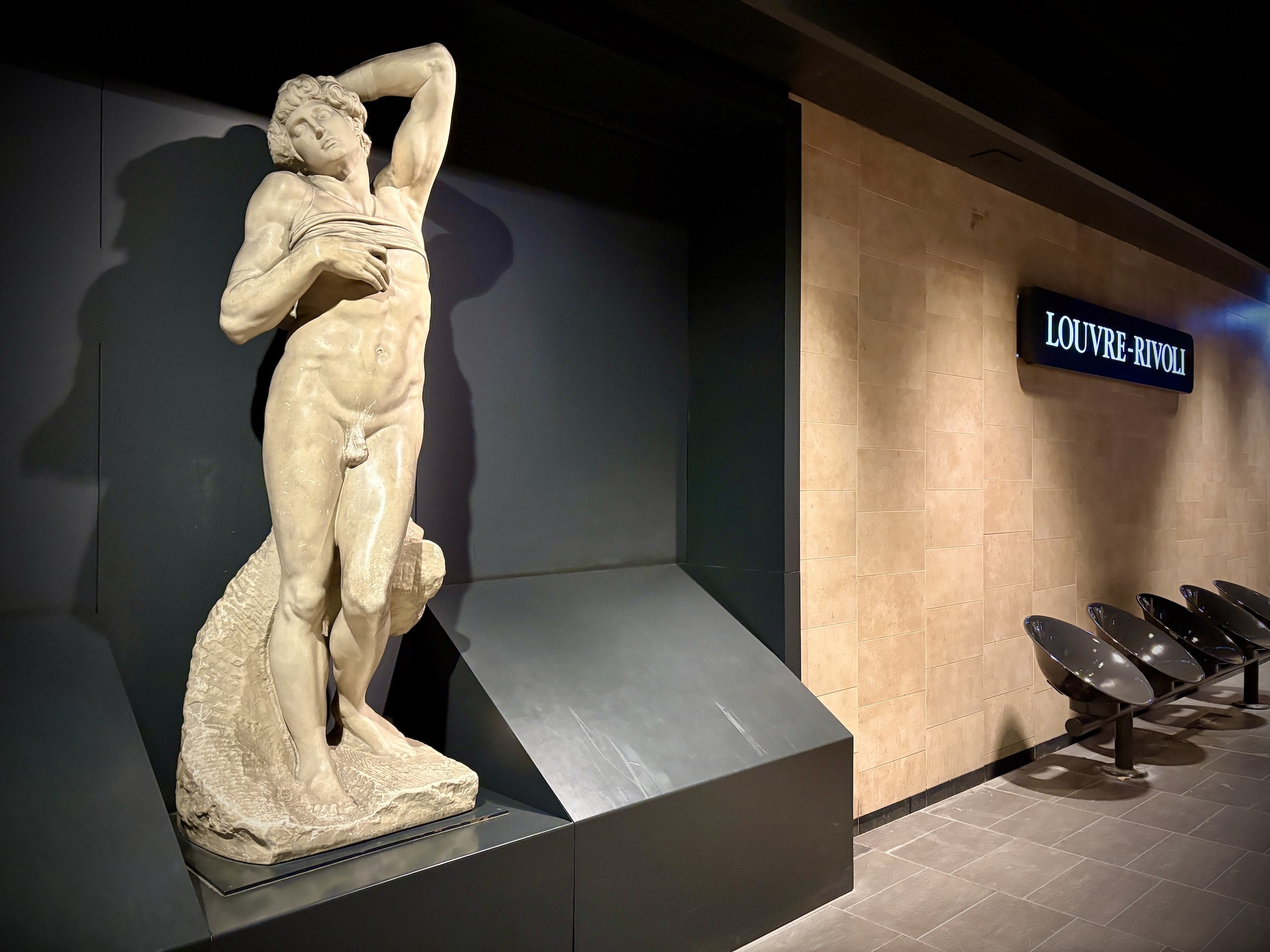 A reproduction of an antique statue from the Louvre collection on the platforms of the Louvre-Rivoli metro station in Paris.