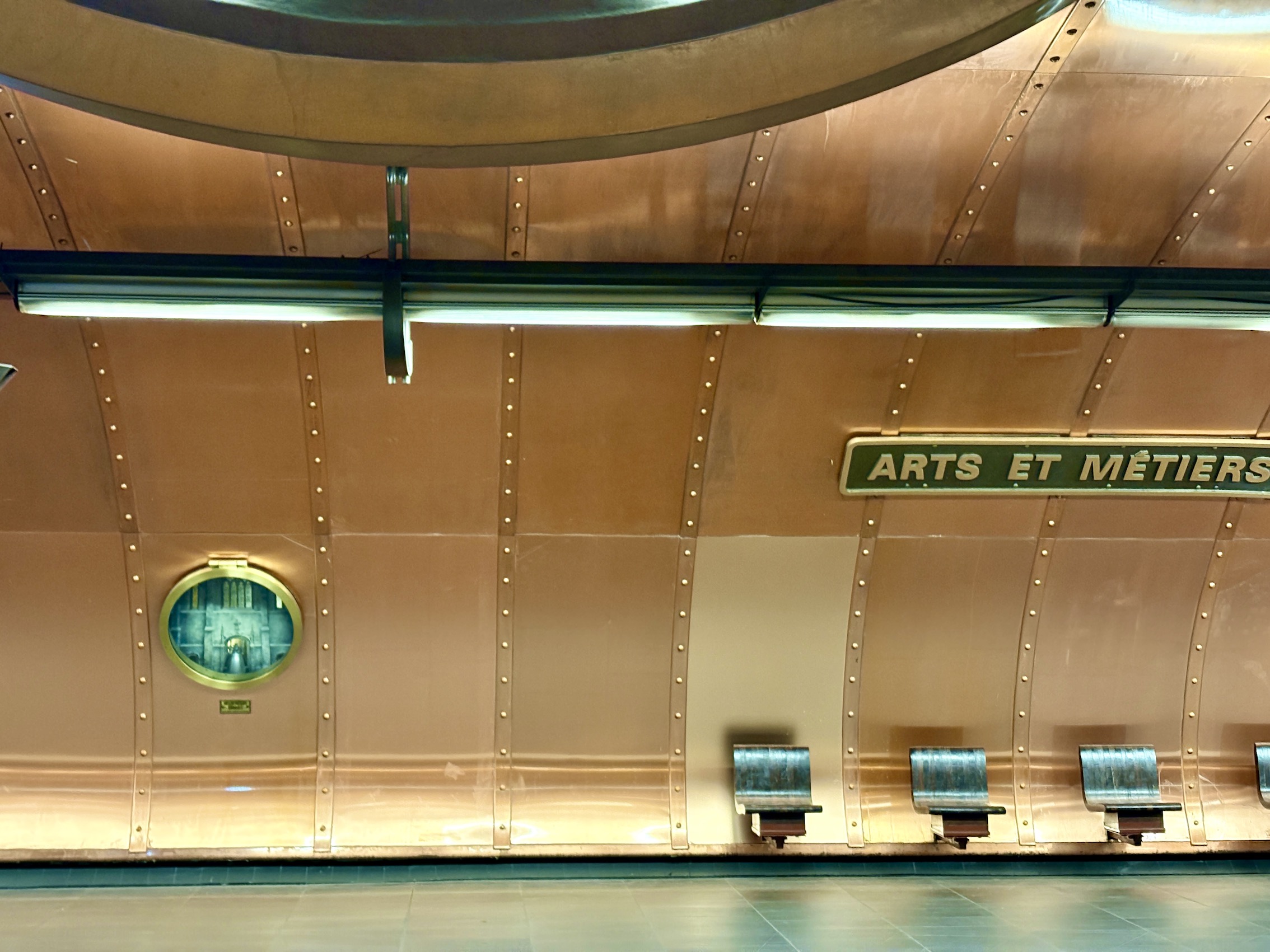 The design of the platforms of line 11 at Arts et Métiers metro station in Paris looks like a steampunk submarine.