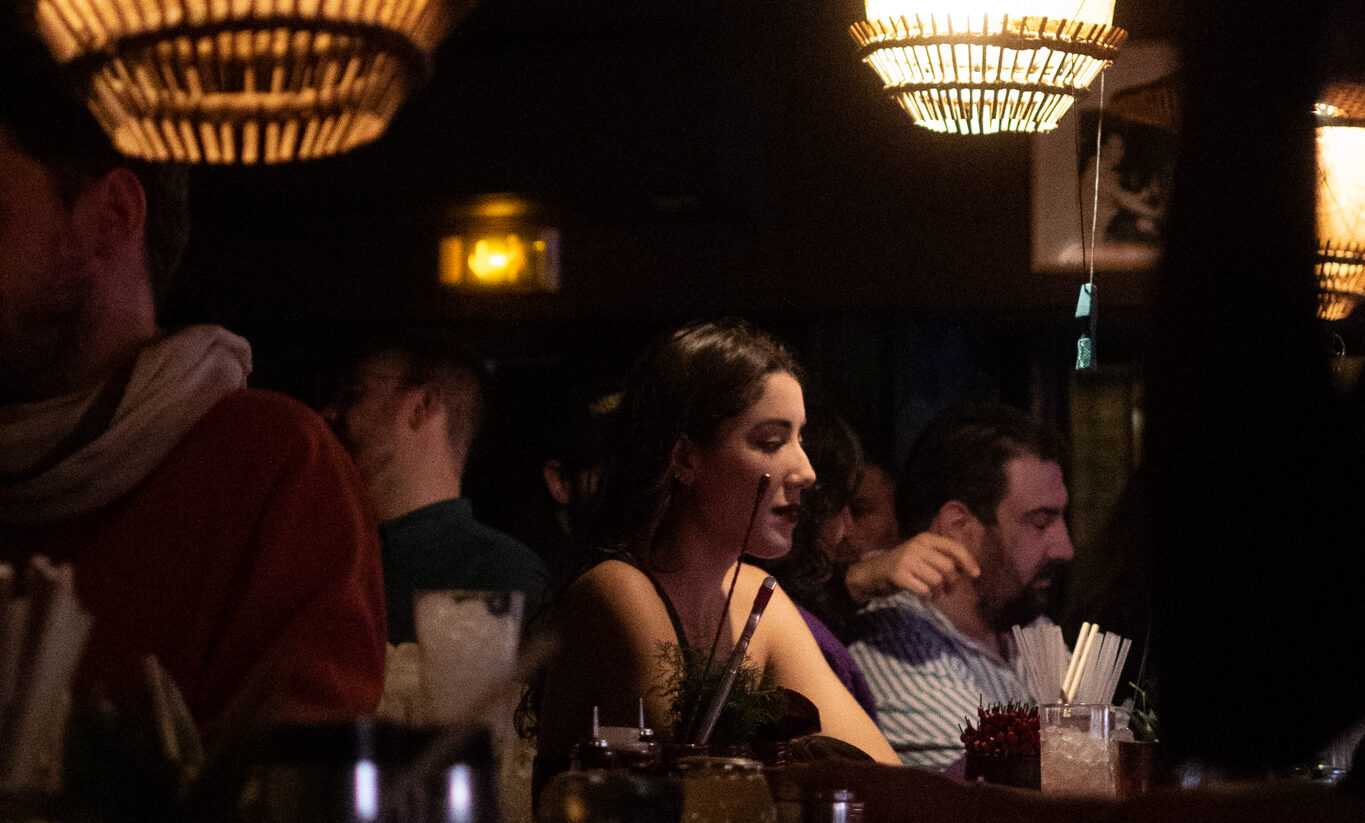 A girl in a dark bar in Pigalle.