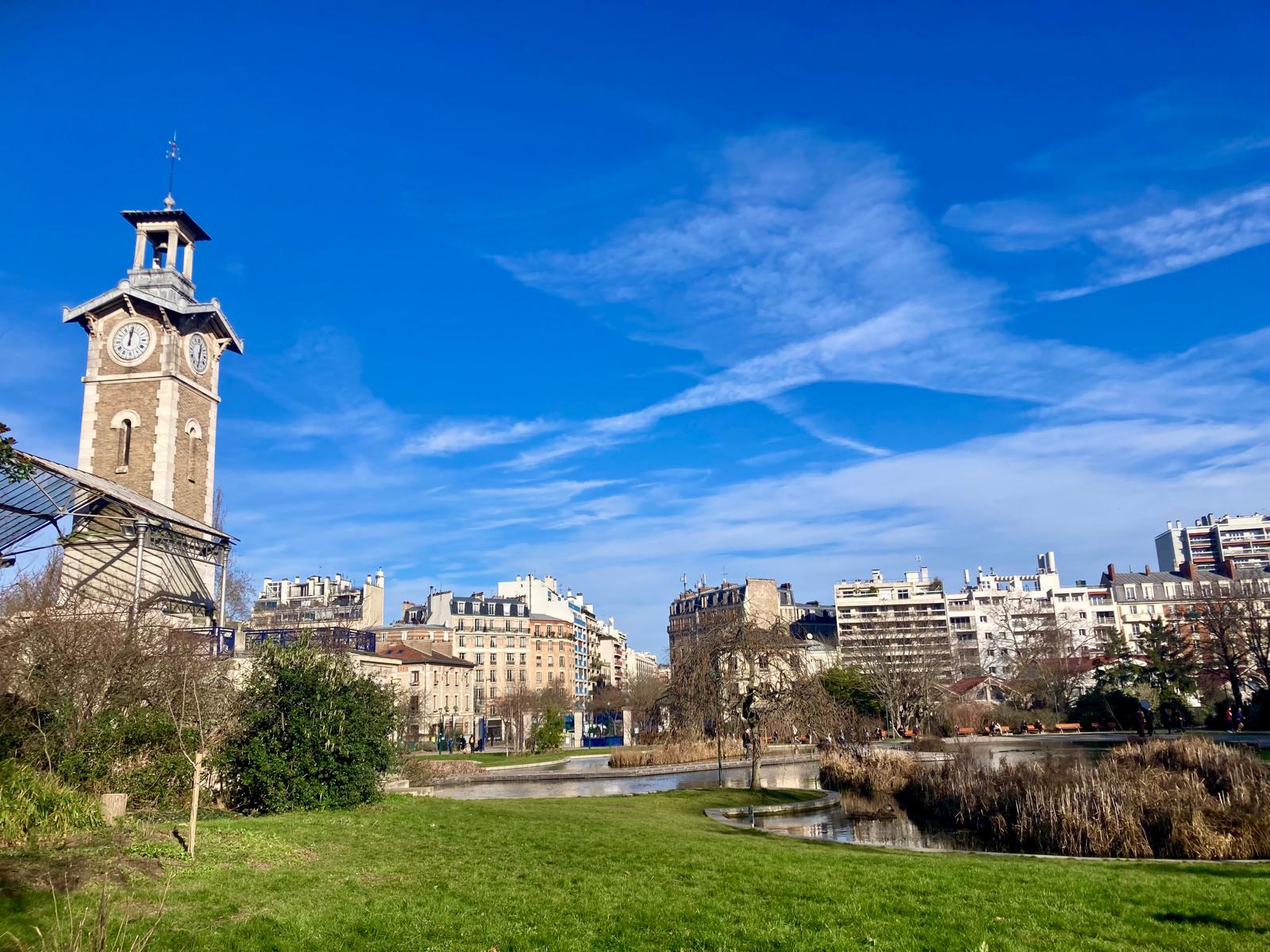 The clock tower and pond in the Parc Georges Brassens in the 15th arrondissement in Paris.