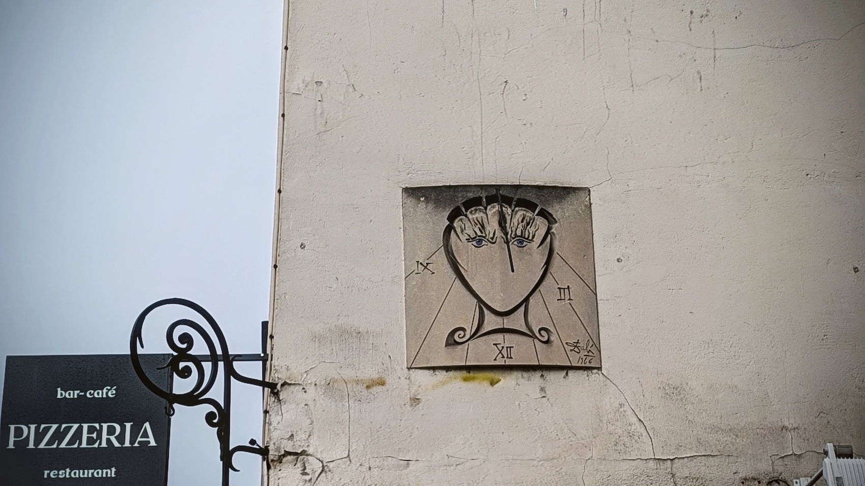 Salvador Dali's sundial hanging in the streets of Paris