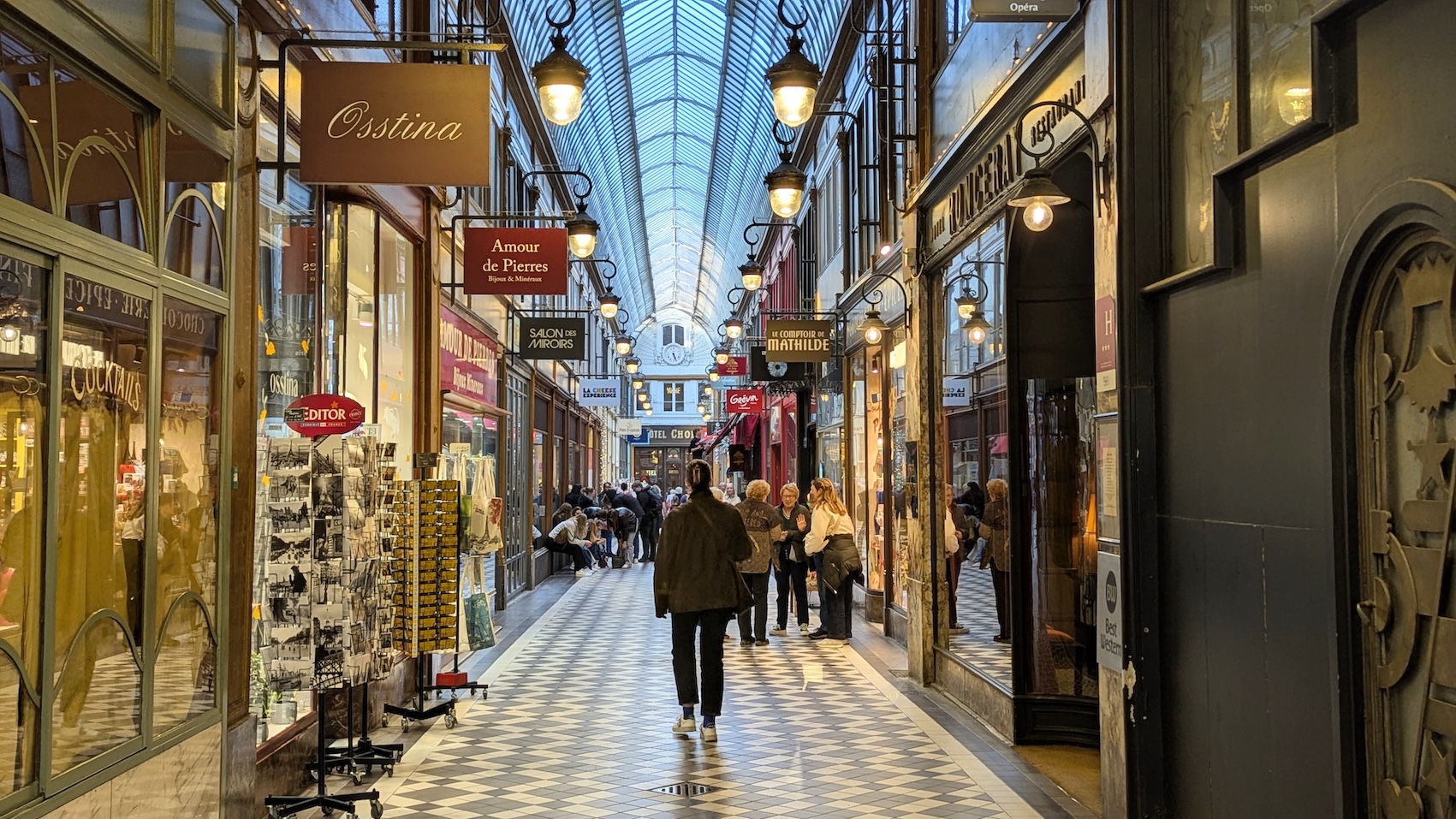 Shoppers stroll inside one of the covered passageways in the 2nd arrondissement.